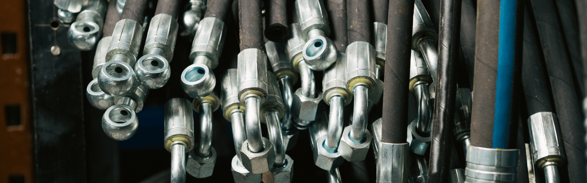 Hose Ware House -Hose Ware House Hundreds of black hydraulic hoses in a corner 1 1